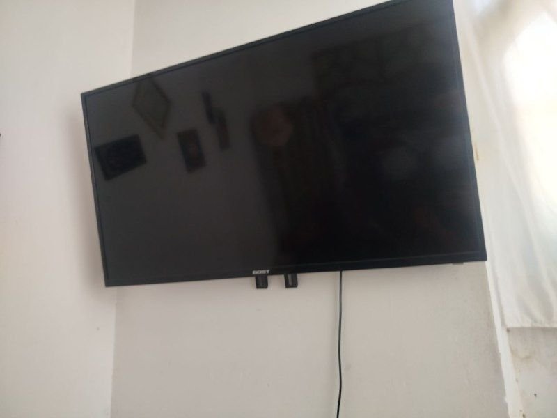 40 inch TV set with cartoons and two controls